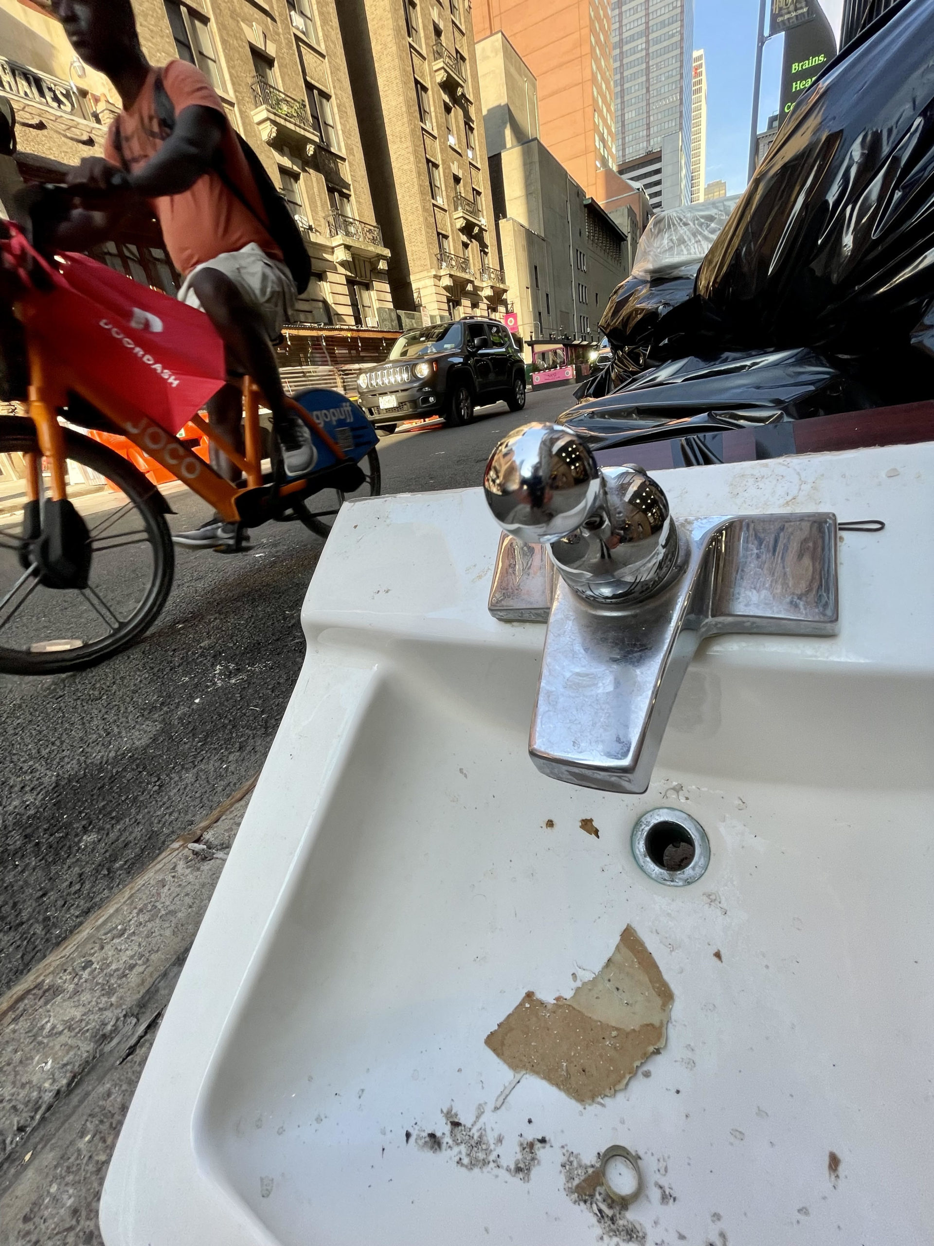 discarded sink in New York City's theater district