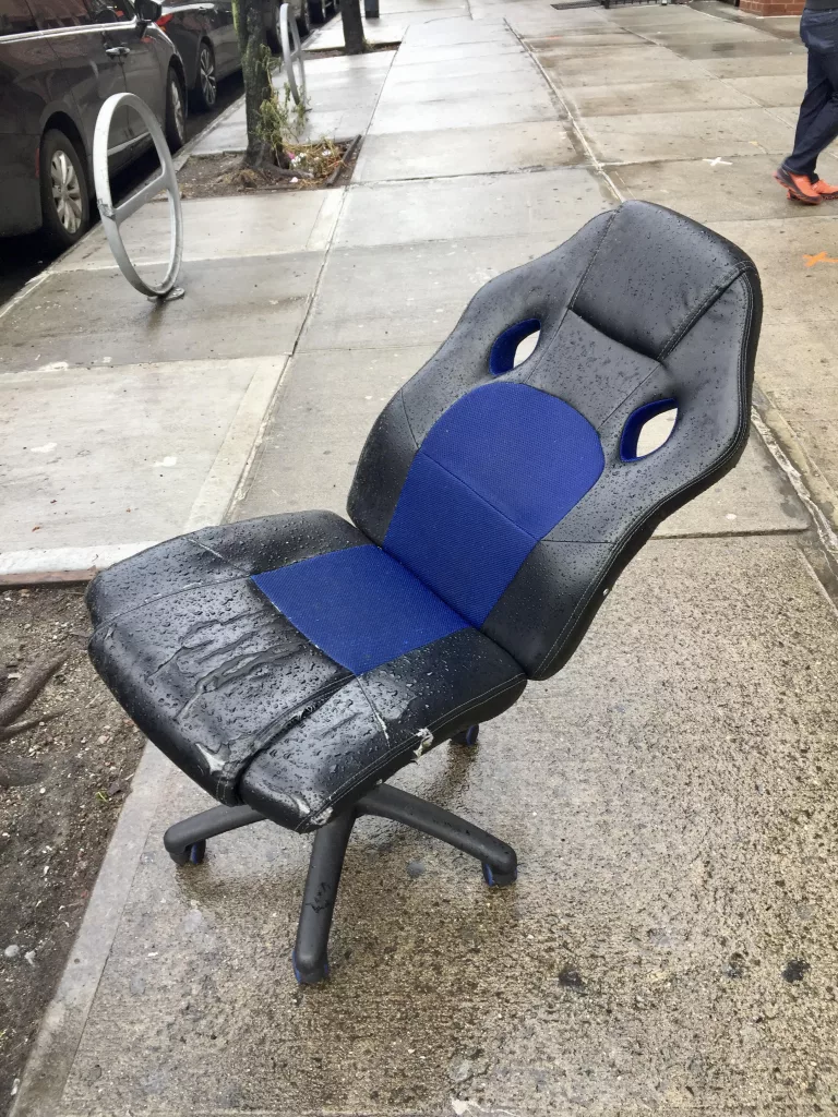 Discarded office chair in New York City.